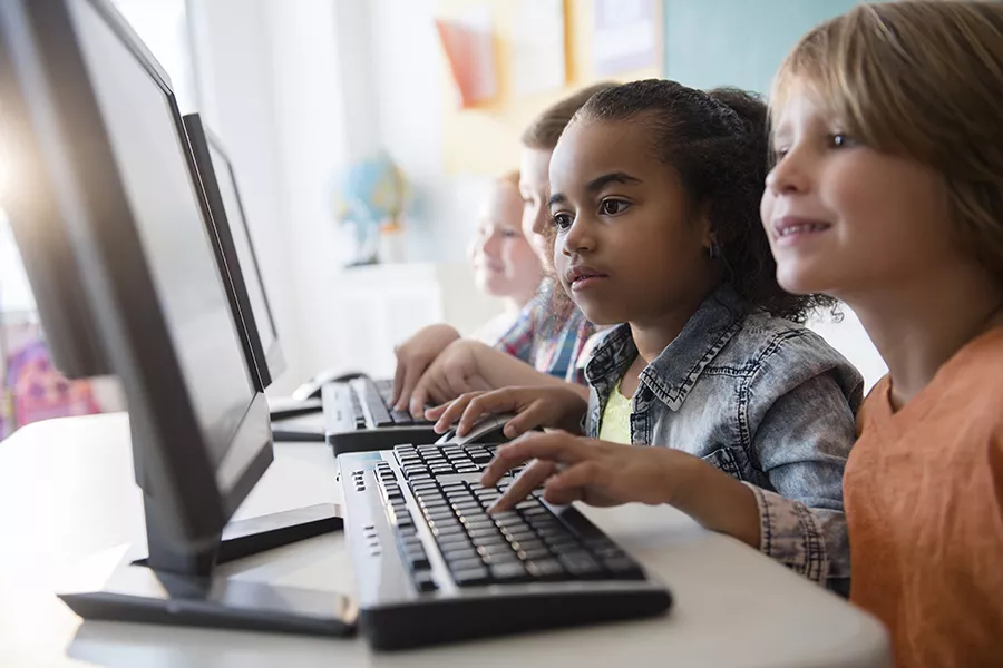 Students using computers in school