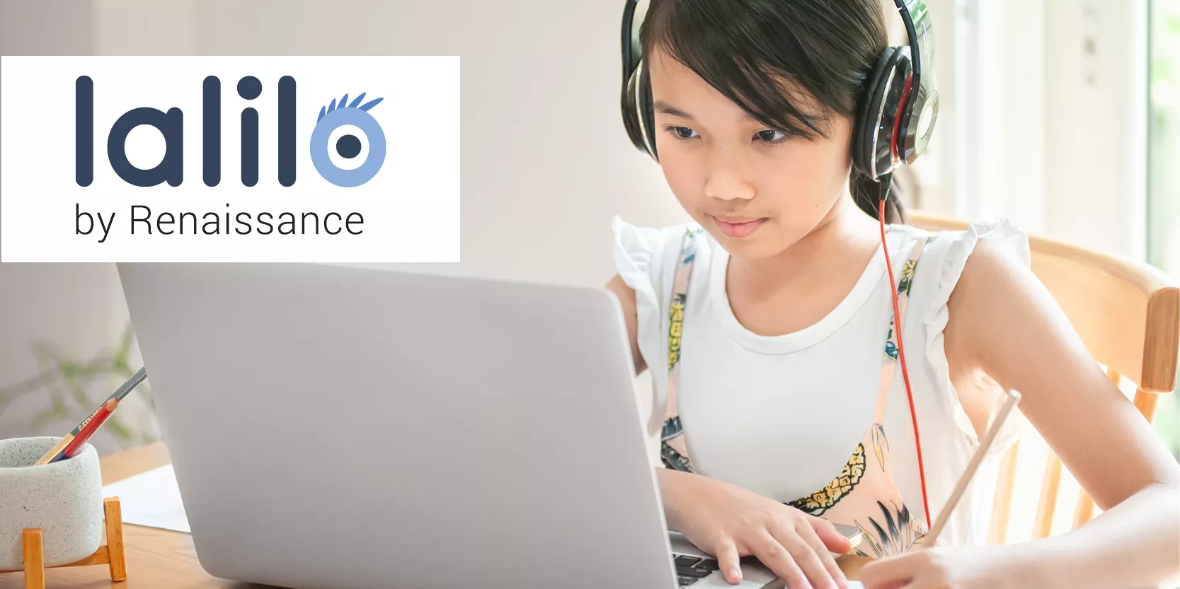 kid looking at a laptop